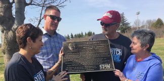 A plaque honouring the late Bill "Mr. Slo-Pitch" Bowers was unveiled Wednesday morning (May 2) in Bowers Park off Brealey Drive in Peterborough. Among those remembering Bowers' milestone contributions to the game at the local, provincial and national were (from left) City of Peterborough recreationist Terry Lynn Johnston, Bowers' son Dan (who travelled from North Dakota for the dedication), and his close friends and Peterborough Slo-Pitch Association colleagues Bob and Maureen Lewis. (Photo: Paul Rellinger / kawarthaNOW.com)