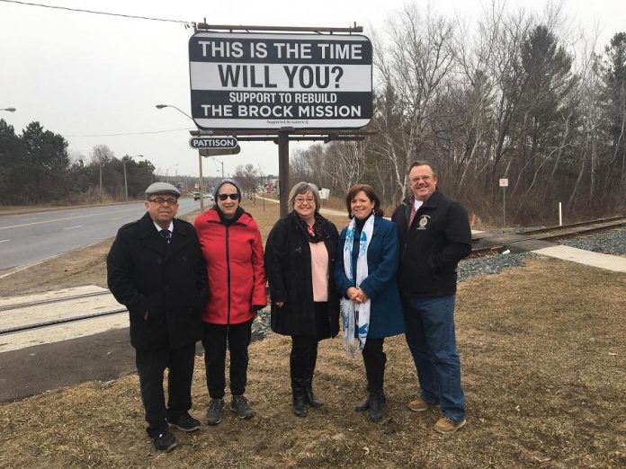 In March, Galerie Q donated this billboard on The Parkway to raiseg awareness of the Brock Mission rebuild project. Pictured are Brock Mission board members Dennis Shebib and Carol Rennick, Galerie Q PR manager Christine McCulloch, Councillor Lesley Parnell and her husband Don. (Photo courtesy of Lesley Parnell)