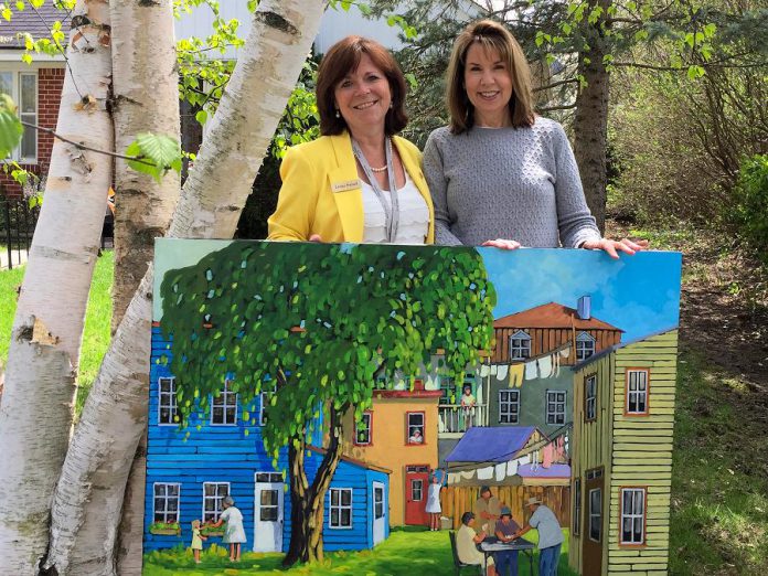 City of Peterborough councillor Lesley Parnell with Meg Seabrook, the winner of a painting by Quebec artist Yvon Lemieux donated by Cavan art gallery Galerie Q to support the rebuild of Brock Mission. Paying it forward, Seabrook has decided to donate the painting, valued at $7,500, to hang in the new Brock Mission when it is completed. (Photo courtesy of Lesley Parnell)