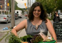 A customer picking up her order from Locavorest, an online farmers' market carrying items from more than 25 local producters. As of May 25, 2018, in addition to picking up orders, customers can now arrange for home delivery within the City of Peterborough. (Photo courtesy of Innovation Cluster)