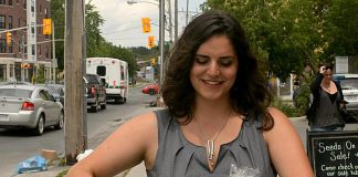 A customer picking up her order from Locavorest, an online farmers' market carrying items from more than 25 local producters. As of May 25, 2018, in addition to picking up orders, customers can now arrange for home delivery within the City of Peterborough. (Photo courtesy of Innovation Cluster)