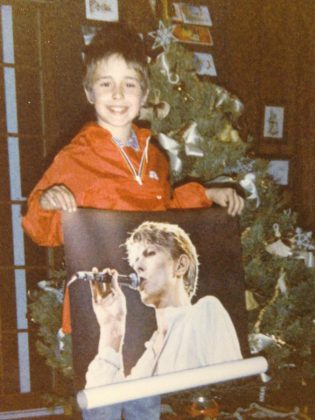 A lifelong David Bowie fan, 10-year-old Danny Michel receives a Bowie poster for Christmas. (Photo courtesy of Danny Michel)