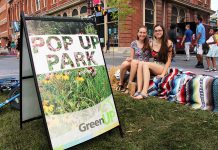 Pulse Pop-Ups are neighbourhood-scaled open street events, also known internationally as play streets, where neighbours turn their residential streets into spaces for playing and gathering for music, food, arts, and play. This Pulse Pop-Up on Harvey Street in Peterborough included a bike playground, as shown, a jug band, pop-up bike lanes, chalk murals, a BBQ, and more. (Photo: Karen Halley)