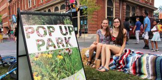 Pulse Pop-Ups are neighbourhood-scaled open street events, also known internationally as play streets, where neighbours turn their residential streets into spaces for playing and gathering for music, food, arts, and play. This Pulse Pop-Up on Harvey Street in Peterborough included a bike playground, as shown, a jug band, pop-up bike lanes, chalk murals, a BBQ, and more. (Photo: Karen Halley)