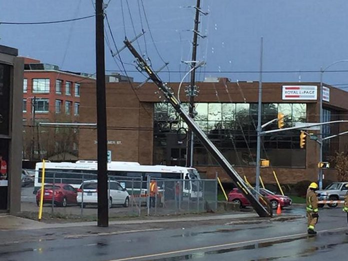 The May 4, 2018 wind storm in southern Ontario caused significant damage including downed trees, damaged roofs, and broken or leaning hydro poles, including this one at Sherbrooke and Aylmer streets in downtown Peterborough. (Photo: Wendy Gibson)