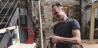 Jesse Bateson, owner and operator of Solid Leather, in his workshop. Bateson, who produces stylish and durable handmade solid leather belts, is one of seven local entrepreneurs who have received a grant under Starter Company Plus, a provincially funded business development program delivered by Peterborough & the Kawarthas Business Advisory Centre. (Photo: Solid Leather / Facebook)