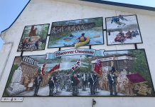 This new mural painted by artist Cliff Smith in the Village of Omemee is designed to encourage the drive-through traffic along Highway 7 to stop and explore the community. It is part of the Discover Omemee initiative, which also includes new maps and signage throughout the village. (Photo courtesy of the City of Kawartha Lakes)