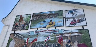 This new mural painted by artist Cliff Smith in the Village of Omemee is designed to encourage the drive-through traffic along Highway 7 to stop and explore the community. It is part of the Discover Omemee initiative, which also includes new maps and signage throughout the village. (Photo courtesy of the City of Kawartha Lakes)