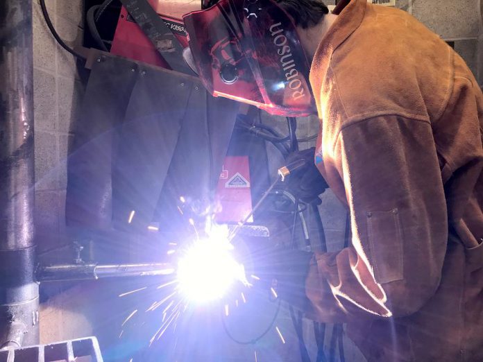 Students like Owen, shown here welding, owe their success to experienced instructors at the Whitby Trade Centre like William Joy, who has been a welder for 40 years.  (Photo: Galen Eagle / PVNC Catholic District School Board)