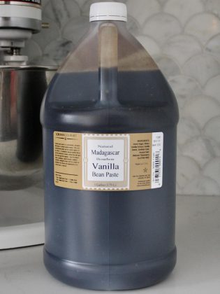 This gallon jug (3.79 L) of Madagascar vanilla bean paste, which would flavour around 96 gallons of vanilla ice cream, costs $510.  This is significant cost for smaller ice cream factories, which might produce several hundred gallons of ice cream in a day.