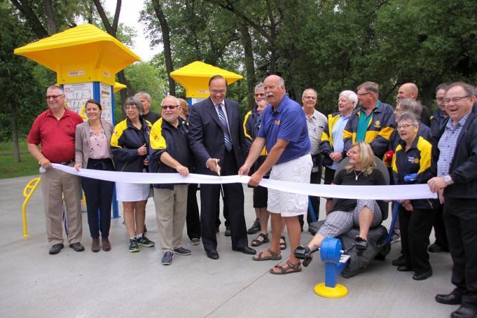 Peterborough Kawarthas Rotary Club president Len Lifchus, City of Peterborough Mayor Daryl Bennett, and incoming Peterborough Rotary Club president Ken Tremblay cut the ribbon officially opening Peterborough's first outdoor adult gym on June 13, 2018 at Beavermead Park.  (Photo: Jeannine Taylor / kawarthaNOW.com)