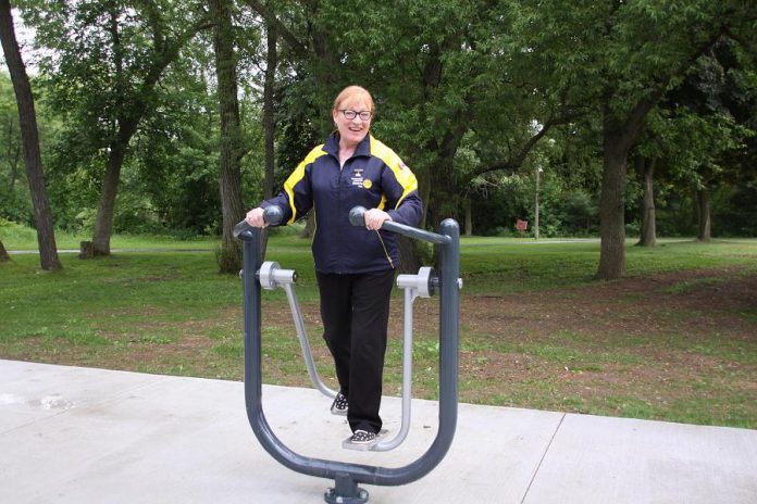 Rotary club member Donna Geary tries out a piece of the equipment. (Photo: Jeannine Taylor / kawarthaNOW.com)