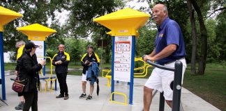 Ken Tremblay, incoming President of the Rotary Club of Peterborough, tries out a piece of equipment at Peterborough's first adult outdoor gym at the official opening on June 13, 2018 at Beavermead Park. The Rotary Club of Peterborough and the Rotary CLub of Peterborough Kawartha each contributed $25,000 to the gym's construction, with the City of Peterborough contributing $40,000. (Photo: Jeannine Taylor / kawarthaNOW.com)