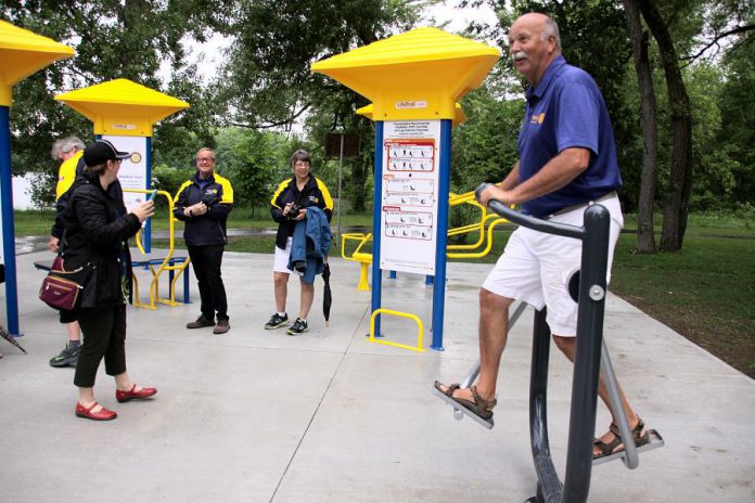 Ken Tremblay, incoming President of the Rotary Club of Peterborough, tries out a piece of equipment at Peterborough's first adult outdoor gym at the official opening on June 13, 2018 at Beavermead Park. The Rotary Club of Peterborough and the Rotary CLub of Peterborough Kawartha each contributed $25,000 to the gym's construction, with the City of Peterborough contributing $40,000. (Photo: Jeannine Taylor / kawarthaNOW.com)