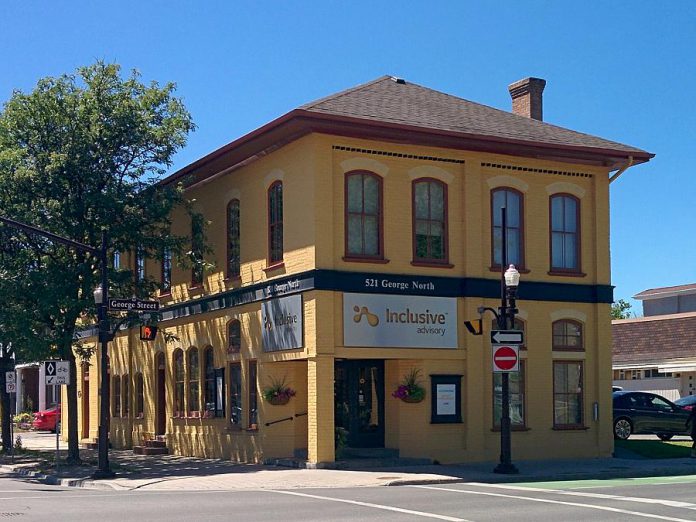 It's hard to miss the yellow building housing Inclusive Advisory, located at 521 George Street North at McDonnel in downtown Peterborough, just north of City Hall. (Photo: Bruce Head / kawarthaNOW.com)