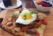 The Monaghan Café in Peterborough is under new ownership. A new menu offers fresh new options like the Sunny Up Pizza, a breakfast pizza with fresh herbs and a sunny-side up egg. Food is made from scratch and served with a bowl of fruit and homemade peanut butter, jam, and ketchup. (Photo: Eva Fisher / kawarthaNOW.com)