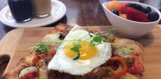 The Monaghan Café in Peterborough is under new ownership. A new menu offers fresh new options like the Sunny Up Pizza, a breakfast pizza with fresh herbs and a sunny-side up egg. Food is made from scratch and served with a bowl of fruit and homemade peanut butter, jam, and ketchup. (Photo: Eva Fisher / kawarthaNOW.com)