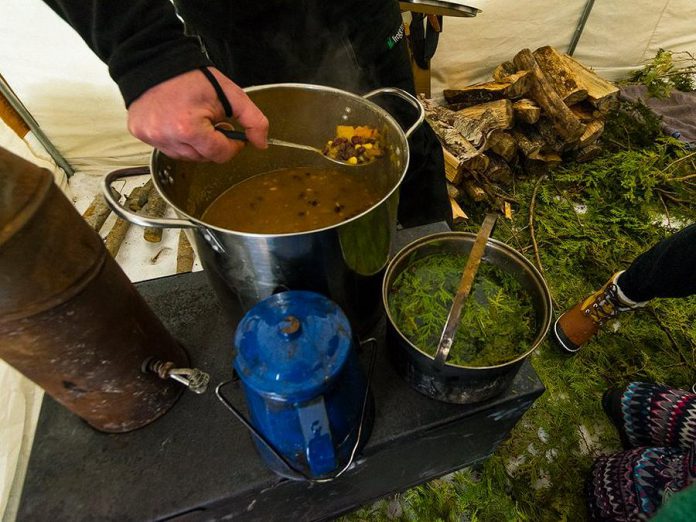 The Land Canadian Adventures offers culinary courses that enable you to eat well in the backcountry. Food on a trip can use traditional and even wild ingredients, like this meal of Three Sisters Stew and Cedar Tea. (Photo: The Land Canadian Adventures)