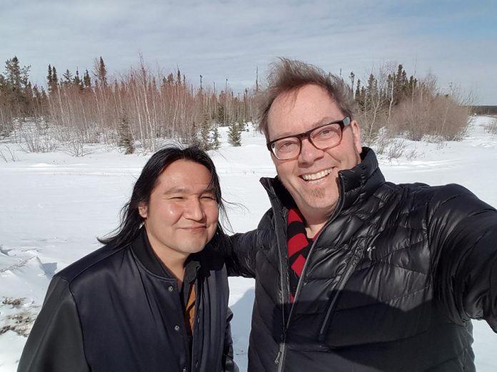 Rick Fines is a strong supporter of musical education. Here he is with Jesse James Gon (aka Diga) at the Chief Jimmy Bruneau School in Edzo in the Northwest Territories in April 2018. (Photo: Rick Fines / Facebook)