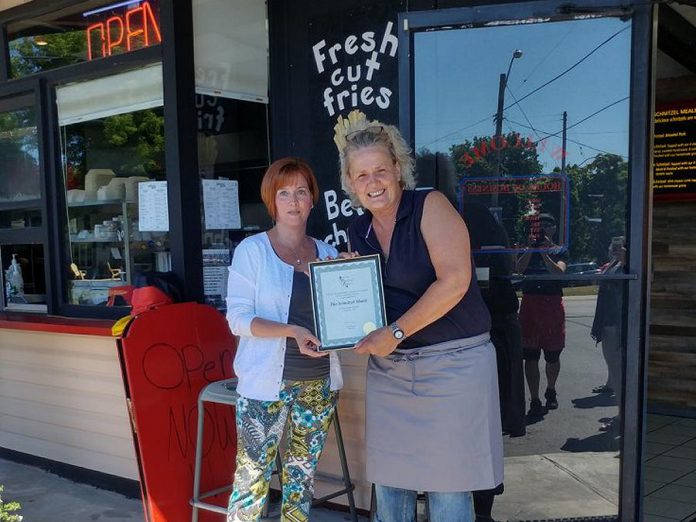 Heather Norris, President of Port Hope and District Chamber of Commerce, congratulates owner Anja Rohlfs on the opening of The Schnitzel Shack in Port Hope. (Photo: Port Hope and District Chamber of Commerce / Facebook)