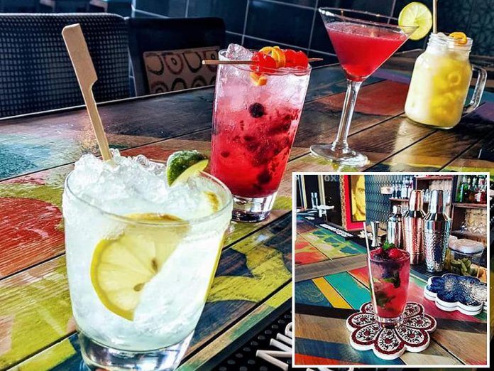 The Twisted Wheel in downtown Peterborough serves a variety of cocktails including the Twisted Berry Twist (inset), made with fresh blueberries and mint. (Photos: The Twisted Wheel)