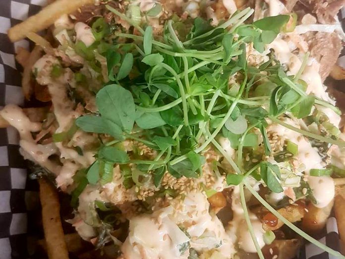 Forget the poutine: Lakehouse on the Run’s Hog Fries are topped with smoked applewood cheddar, Korean-style shredded pork, a hoisin-style glaze, a cabbage and kale coleslaw, green onions, toasted sesame seeds, sriracha mayo and pea shoots. (Photo: Shaun Zoernack)