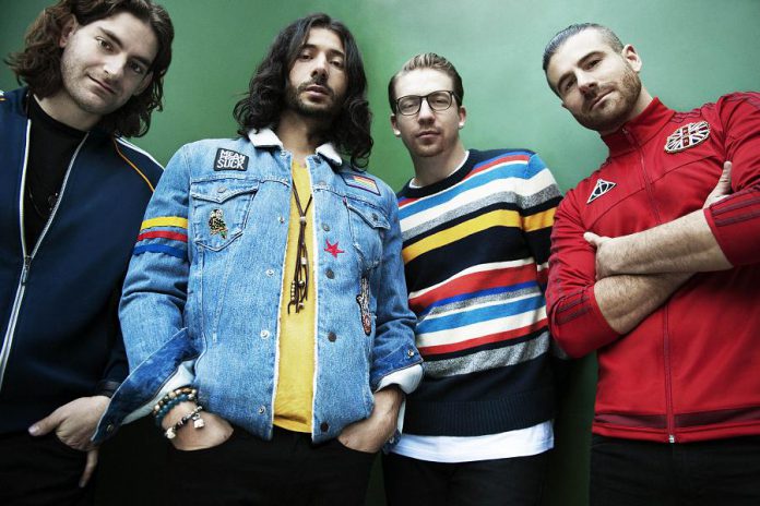 Pop-reggae band Magic! (bassist Ben Spivak, lead singer/guitarist Nasi Atweh, drummer Alex Tanas, and guitarist/keyboardist Mark Pellizzer) performs a free concert at Peterborough Musicfest in Del Crary Park on Saturday, July 7, 2018. (Publicity photo)