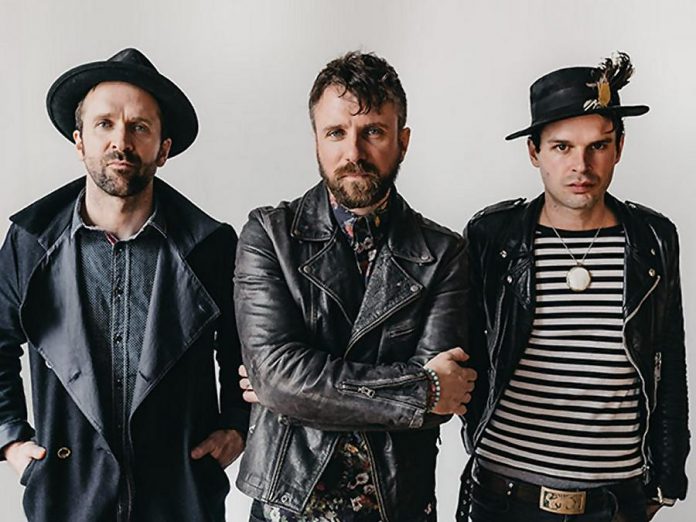 The Trews (pictured are founding members vocalist Colin MacDonald, guitarist John-Angus MacDonald, and bassist Jack Syperek) will be performing a free concert along with current drummer Chris Gormley and long-time touring keyboardist Jeff Heisholt at Peterborough Musicfest on Wednesday, July 4th at Del Crary Park. (Publicity photo)