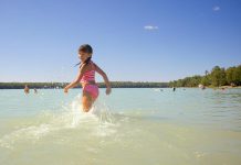 Sandy Beach in Trent Lakes is very popular among residents and visitors because of its soft sand extending into warm and shallow turquoise water. (Photo: Michael Hurcomb)