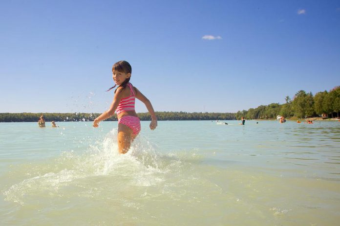 Sandy Beach in Trent Lakes is very popular among residents and visitors because of its soft sand extending into warm and shallow turquoise water. (Photo: Michael Hurcomb)