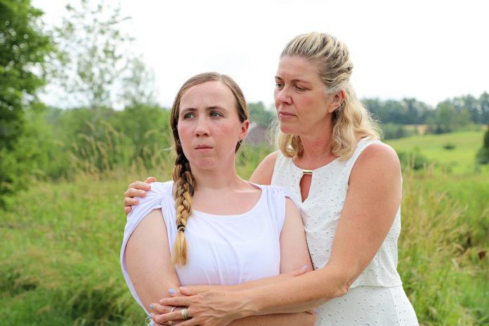 In Judith Thompson's "Who Killed Snow White?", an act of violence shatters the world of 15-year-old Serena (Grace Thompson, pictured here with Cynthia Ashperger as her mom). Unlike the usual historical fare at 4th Line Theatre, this play explores the topical subjects of social media and cyberbullying among today's youth. The play premieres at the Winslow Farm in Millbrook on August 6 and runs until August 25, 2018. (Photo: Heather Doughty / kawarthaNOW.com)