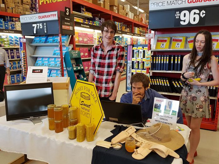 Nathan Clifford (left) of Green Improvements is developing a computer-based system to enable beekeepers to monitor the health of their hives. Nathan is one of nine young entrepreneurs participating in this year's Summer Company program in the Kawarthas, an Ontario government program administered locally through the Peterborough & the Kawarthas Business Advisory Centre. A showcase of the student-run companies was held at Staples in Peterborough as part of the province-wide Summer Company-Staples Youth Entrepreneurship Day on July 4, 2018. (Photo: Amy Bowen / kawarthaNOW.com)