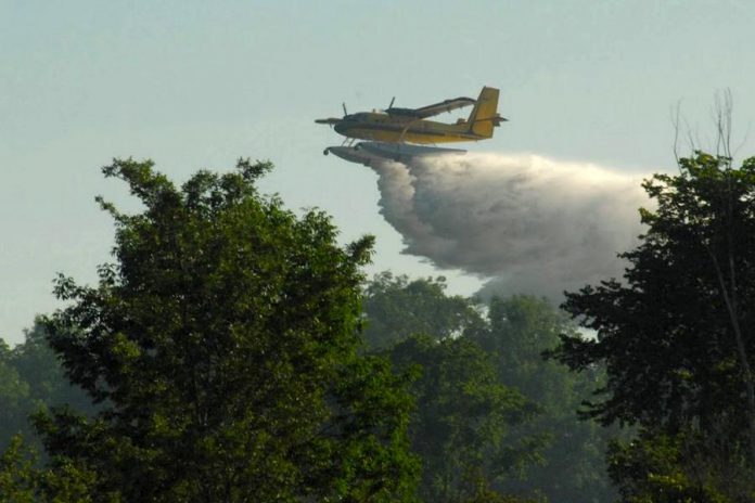 Kawartha Lakes resident Dean Nighswander took this shot of an Ontario Ministry of Natural Resources and Forestry water bomber dropping its load on a brush fire north of Glenarm in the City of Kawartha Lakes on July 7, 2018. (Photo courtesy of Dean Nighswander)