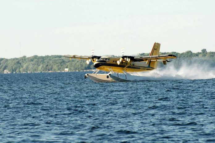 To fill its holding tanks, a water bomber skims along the surface for around 600 metres. (Photo courtesy of Dean Nighswander)