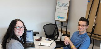 Young entrepreneur Dylan Trepanier of Alexander Optical (right) spent his summer in The Cube at the Innovation Cluster in the Slingshot program developing his business plan for an on-demand mobile eye examination clinic. He won $1,000 after pitching his idea to a panel of judges on August 24, 2018. (Photo courtesy of the Innovation Cluster)