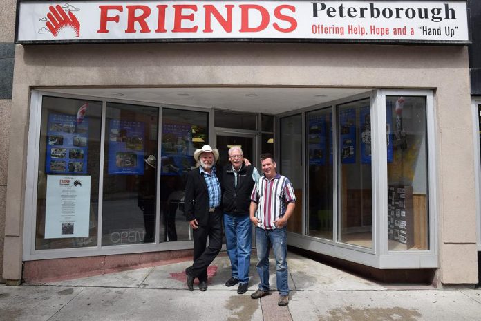 Musician Washboard Hank, David Fisher, and musician Pete Gauthier in front of FRIENDS Peterborough at 283 George Street North in downtown Peterborough. The two musicians have organized a benefit concert on Sunday, August 26th at Del Crary Park to raise funds for FRIENDS Peterborough, a Christian-based agency that provides support and assistance for people who are homeless or marginalized. (Photo: Markus Maar)