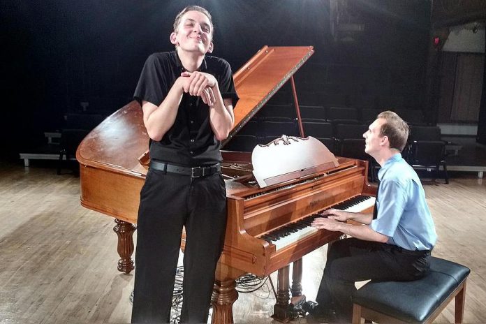 Victor Pokinko, shown here performing as Dahlia Whitney, plays all the characters in "Murder for Two" except for Officer Marcus, performed by Matt Pilipiak (right). Using a piano previously owned by theatrical legend Colm Wilksinon, the two actors also perform all the songs in the musical comedy. (Photo: Sam Tweedle / kawarthaNOW.com)