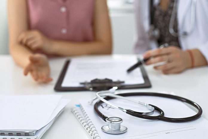 A doctor conducting a medical consultation