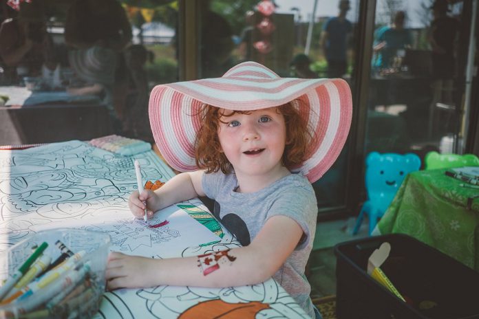As well as local food, the Peterborough Regional Farmers' Market is a social asset for the community, with areas where shoppers can sit, eat, visit, engage, and linger, and family friendly, with a kids' zone that includes crafts, colouring, and water toys. (Photo: Jenn Austin-Driver)