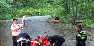 Barry Killen captured this scene of a rescue in Kawartha Highlands Provincial Park of a camper who was injured when a piece of equipment containing flammable liquid exploded at her remote campsite on Shark Lake. The woman, who suffered burns to areas of her body, was later airlifted by helicopter to Peterborough Regional Health Centre. (Photo: Barry Killen)