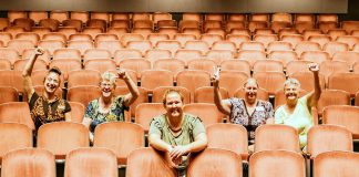 Showplace Performance Centre General Manager Emily Martin (centre) with some of the members of the not-for-profit charitable organization's team (left to right): House and Volunteer Manager Kait Dueck, Board Chair Pat Hooper, and Box Office Assistants Diane Stiles and Maureen Lewis (not pictured: Box Office Manager Theresa Foley, Marketing and Development Manage Susan Oliver, and Membership Coordinator Arlene Davis). Previously Marketing Manager, Emily was appointed General Manager in April 2017 after acting in the position for almost a year. (Photo: Heather Doughty)