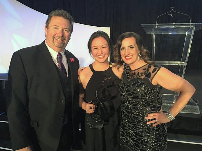 Grace Reynolds (centre) with her Best Newcomer Agent award at the Mortgage Awards of Excellence in May 2018. Also pictured are two of the head team members from Verico Financial Group Inc., the top mortgage broker network in Canada, of which Grace is a member. (Supplied photo)