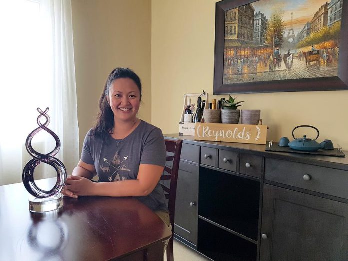 Mortgage broker Grace Reynolds at home with her Best Newcomer Agent award from the Mortgage Awards of Excellence in May 2018. Along with her award-winning work as a broker, Grace is also involved with supporting the local community and she is serving the second year of her term on the board of the Women's Business Network of Peterborough. (Photo: Amy Bowen / kawarthaNOW.com)