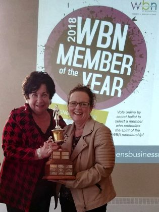 Before being elected as  2018-19 President of the Women's Business Network of Peterborough, Tracey Ormond was also voted the 2018 WBN Member of the Year. Here she accepts a "keeper version" of the award from Maureen Tavener at the organization's May 2018 meeting. (Photo: Paula Kehoe / WBN)