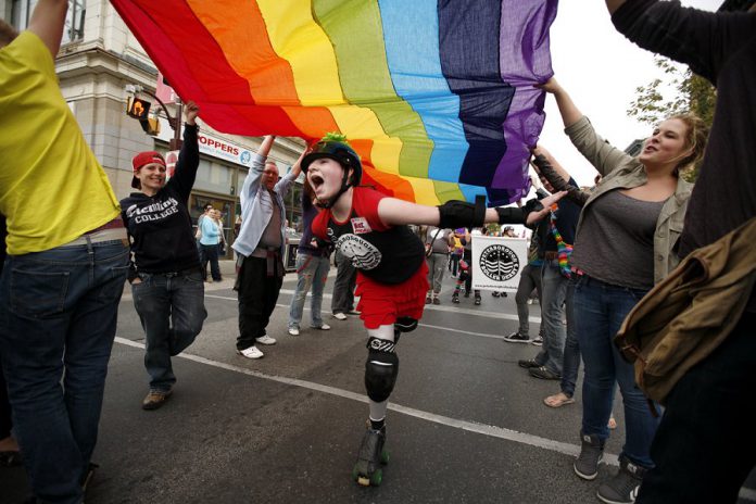 The colours of the rainbow flag reflect the diversity of the LGBTQ+ community, and the flag is often used as a symbol of Pride in LGBTQ+ rights marches. It originated in California but is now used worldwide. Variations of the rainbow flag are widely displayed, including at Peterborough's annual Pride Parade. (Photo: Peterborough Pride)