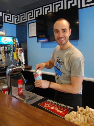 Giorgos Kallonakis, owner of the popular Port Hope resaturant Olympus Burger, makes a Pennywise Float. (Photo: April Potter / kawarthaNOW.com)