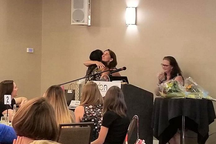 Past president Lorie Gill congratulates Grace Reynolds, named Vice-President of the Women's Business Network of Peterborough, as 2018-19 President Tracey Ormond applauds. (Photo: Rencee Noonan / WBN)