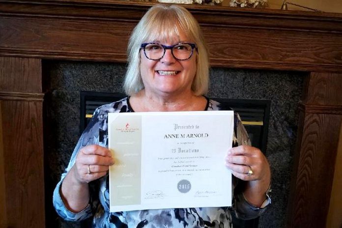 One of the ways the Women's Business Network of Peterborough is giving back to the community in 2018-19 is by organizing blood donor drives. Pictured is WBN member Anne Arnold with a certificate from Canadian Blood Services recognizing her 75 blood donations. (Photo: Anne Arnold)