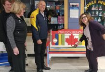 Roger Neilson Public School principal Denise Humphries (right) cuts the ribbon on the Rotary Buddy Bench as Nate Loch, Rotarian Donna Geary, and Rotary Club of Peterborough Kawartha president Brian Prentice look on. Geary and her son Nate initiated the Rotary Buddy Bench program in Peterborough last year, donating a bench to St. Catherine's Catholic Elementary School in Peterborough. (Photo: Rotary Club of Peterborough Kawartha)