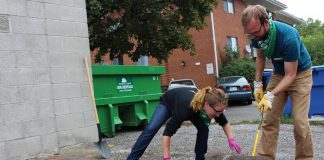 Volunteers remove pavement at the corner of Brock St. and Park St. in Peterborough, where a busy walkway in front of The Wine Shoppe on Park was transformed in 2016 from asphalt into a beautiful garden to divert 200 cubic meters of stormwater. GreenUP's fourth and largest Depave Paradise project will take place at the new Downtown Vibrancy Project site at the south end of Millennium Park, behind the No Frills parking lot, on October 11 and 12, 2018. (Photo: GreenUP)